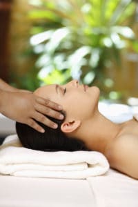 Goal SPA Units are refreshing. Photo is of a woman receiving a scalp massage in a spa.