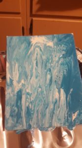 Acrylic pour with shades of blue to match decor